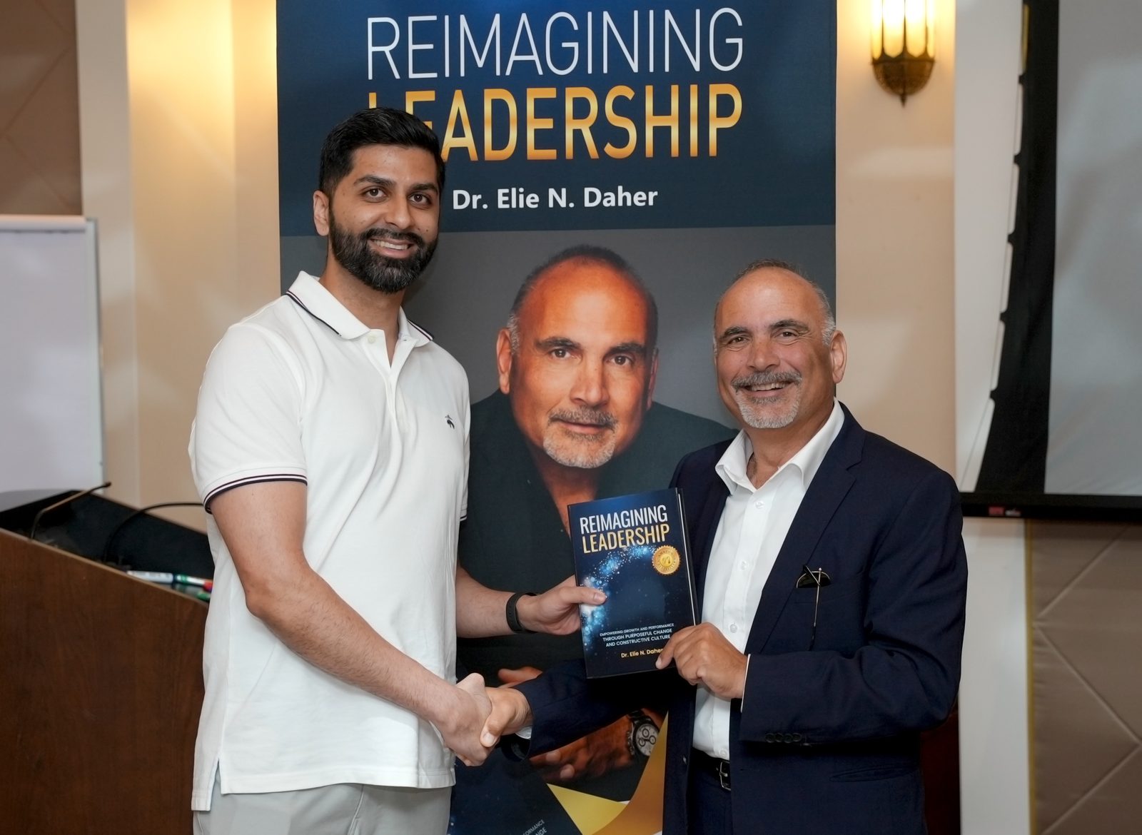 Dr. Elie Daher at a book signing for Reimagining Leadership