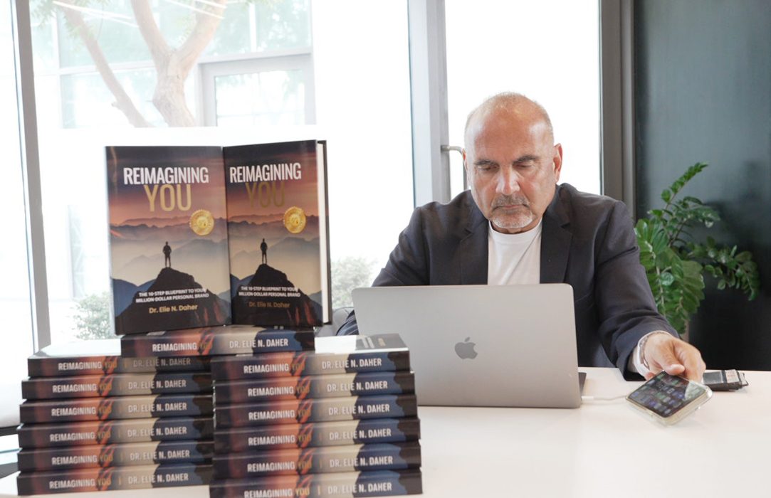 Dr. Elie Daher signing Reimagining You at the Dubai launch
