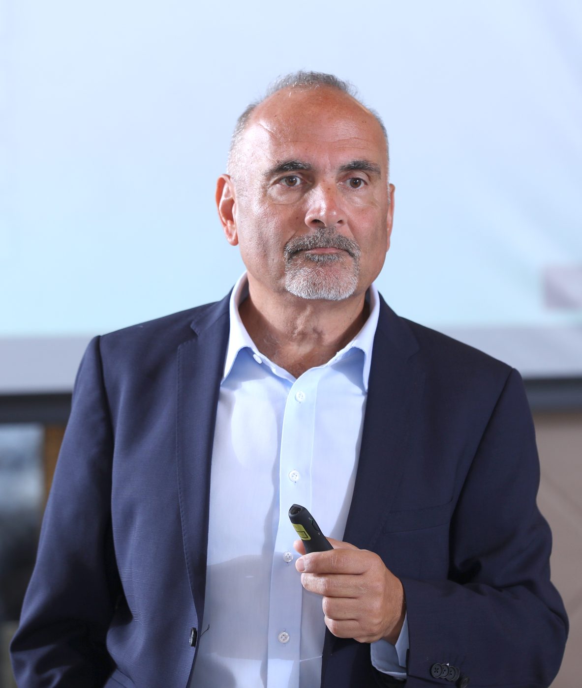Dr. Elie Daher speaking to a leadership audience