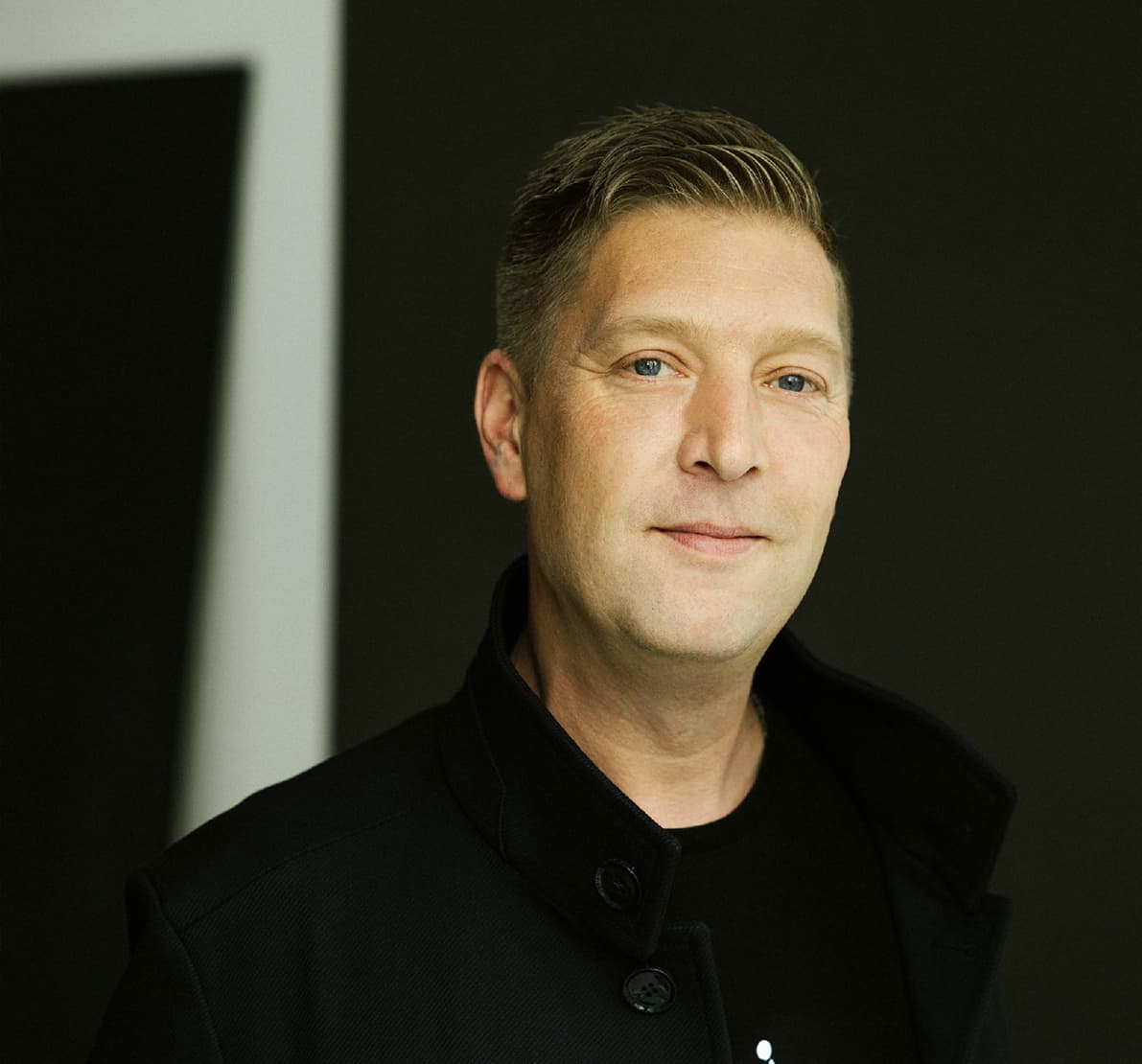 American gentleman in a black shirt smiling