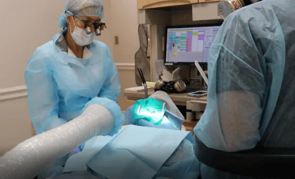 Dentist is scanning a patient's mouth