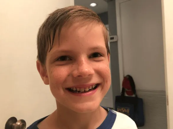 A little boy is smiling