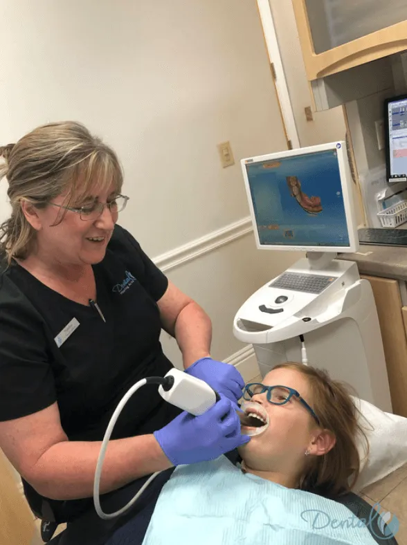 Hygienist performing a cleaning on a patient
