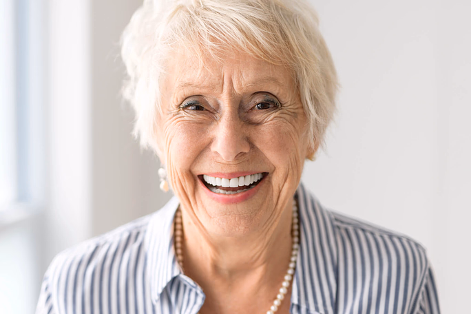 old woman with Ceramic Dental Implants