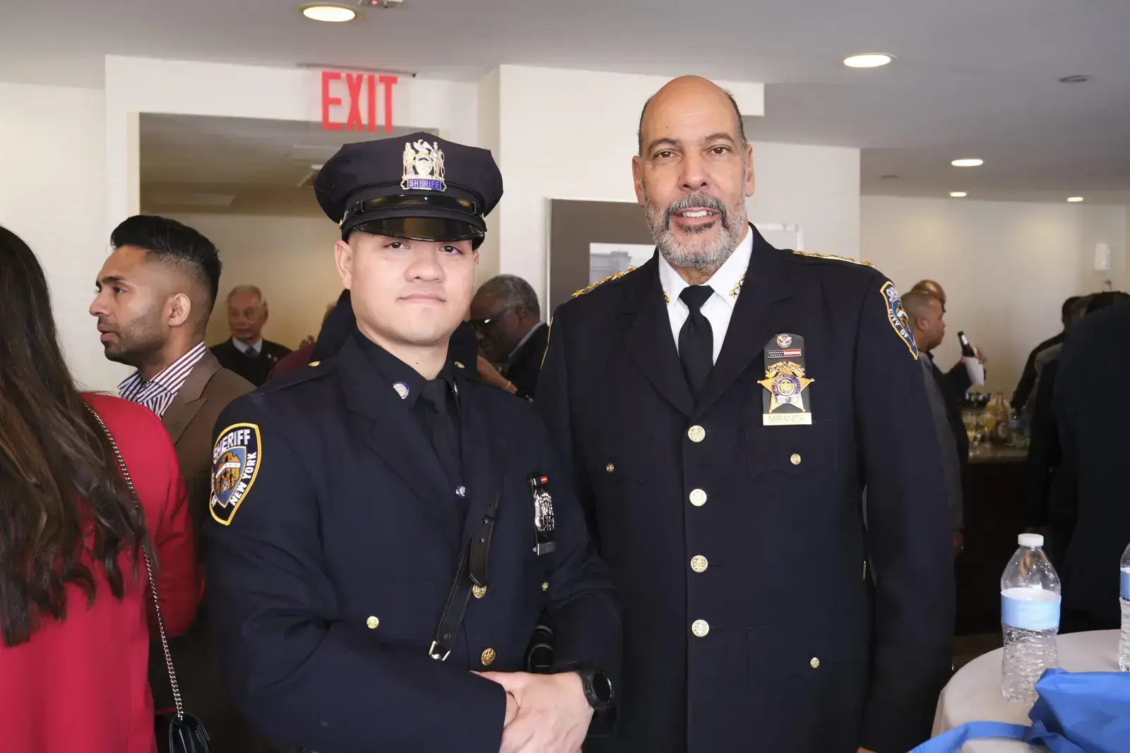 Two police officers in uniform at community event