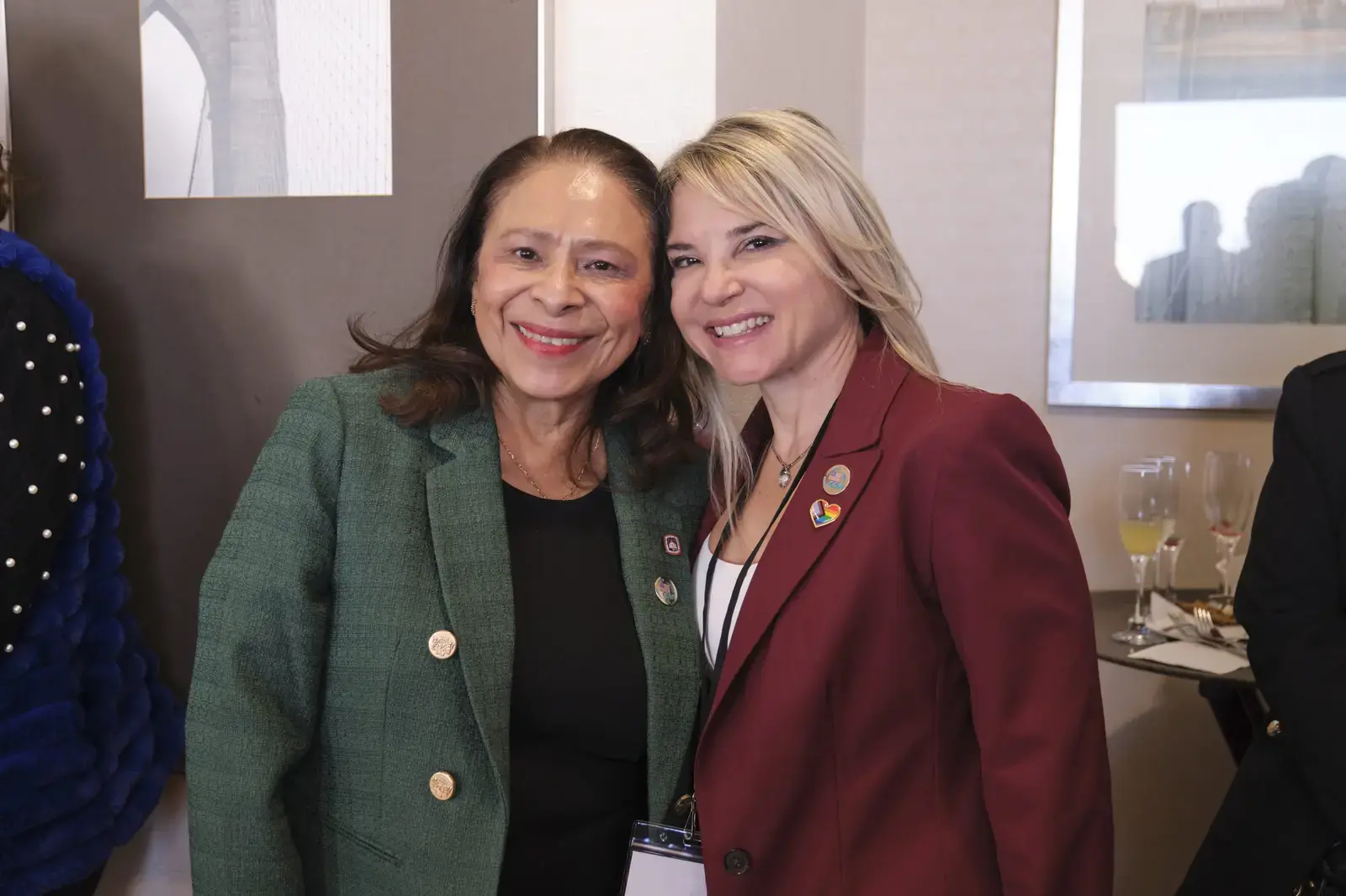 Two women smiling together at school event