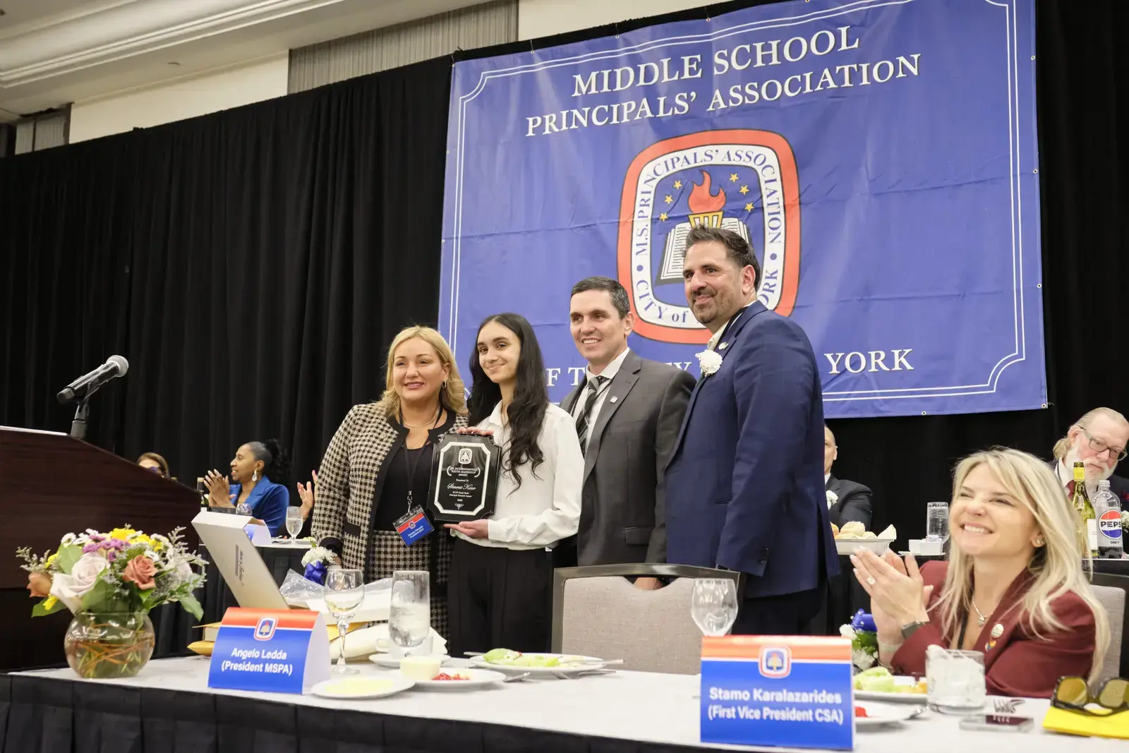 Award recipient poses with Middle School Principals Association leadership