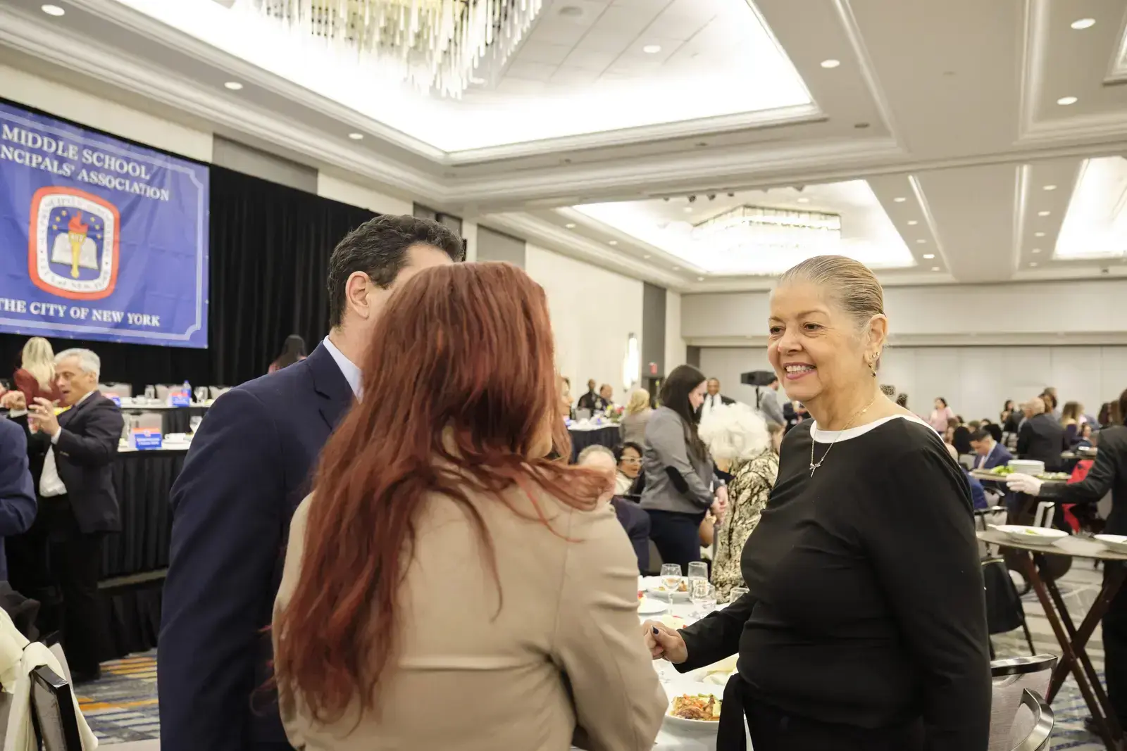 Attendees networking at Middle School Principals Association event