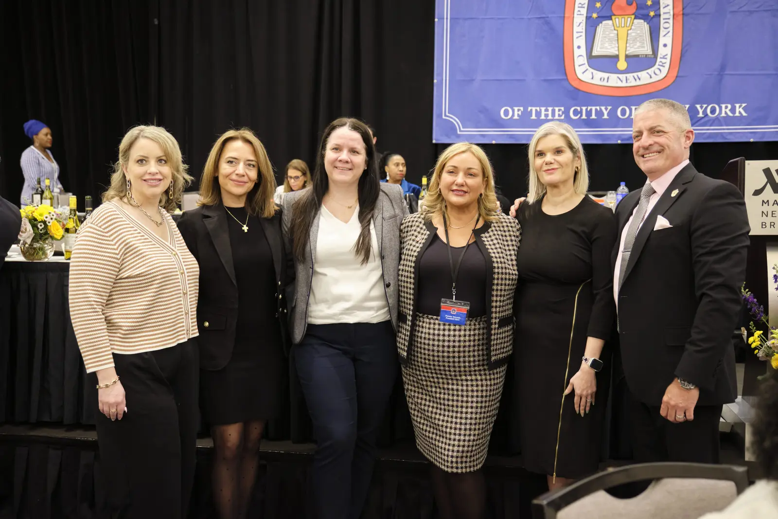 Six educators pose together at New York City school event