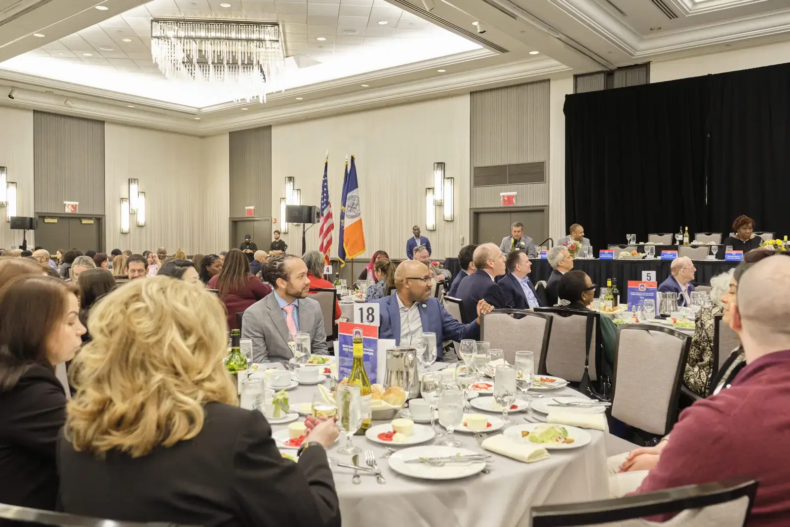 Attendees seated at tables during formal banquet event