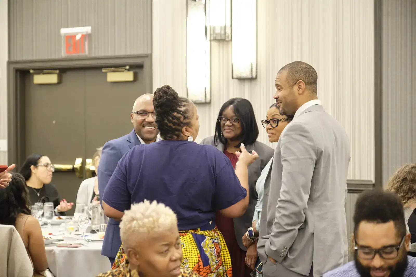 Educators networking and conversing at a school event