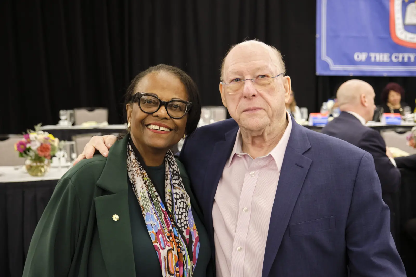 Two board members posing together at school district event