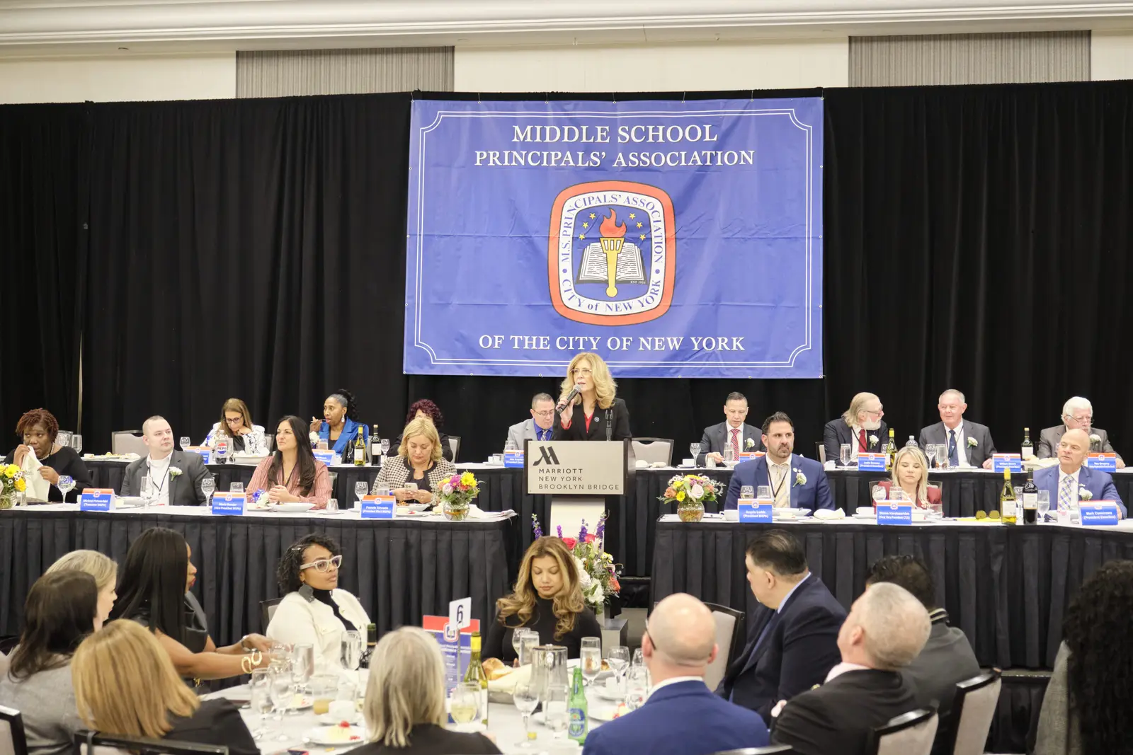 Middle School Principals' Association meeting with speaker at podium