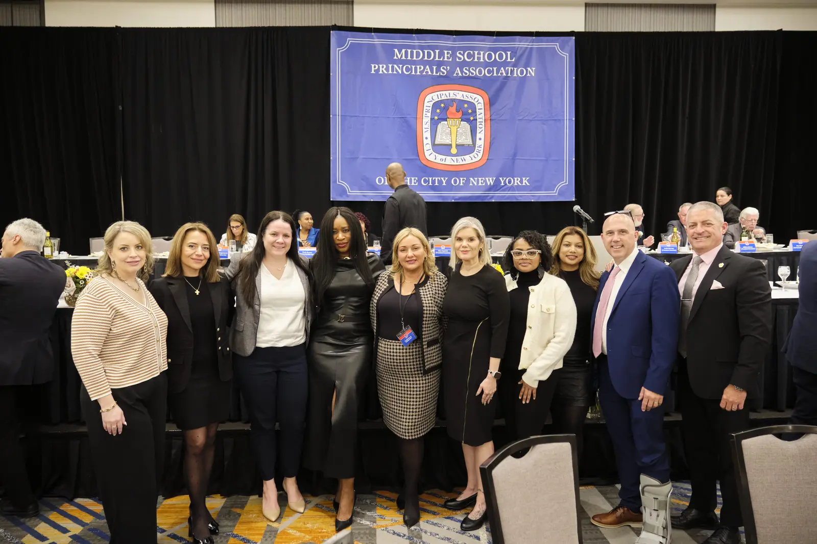 Middle school principals posing at association meeting in New York City