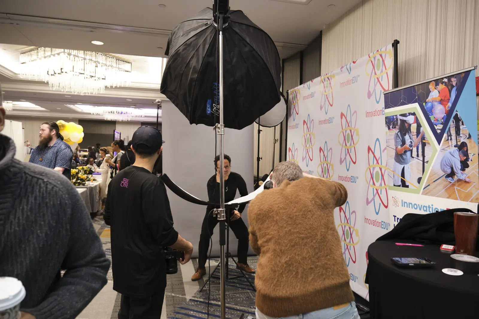 Student in bear costume poses at photo booth