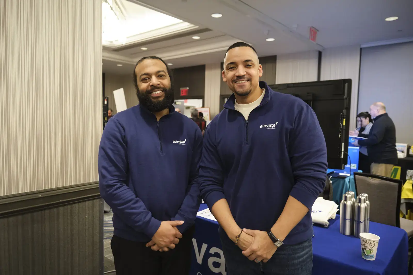 Two representatives from Elevate at school career event