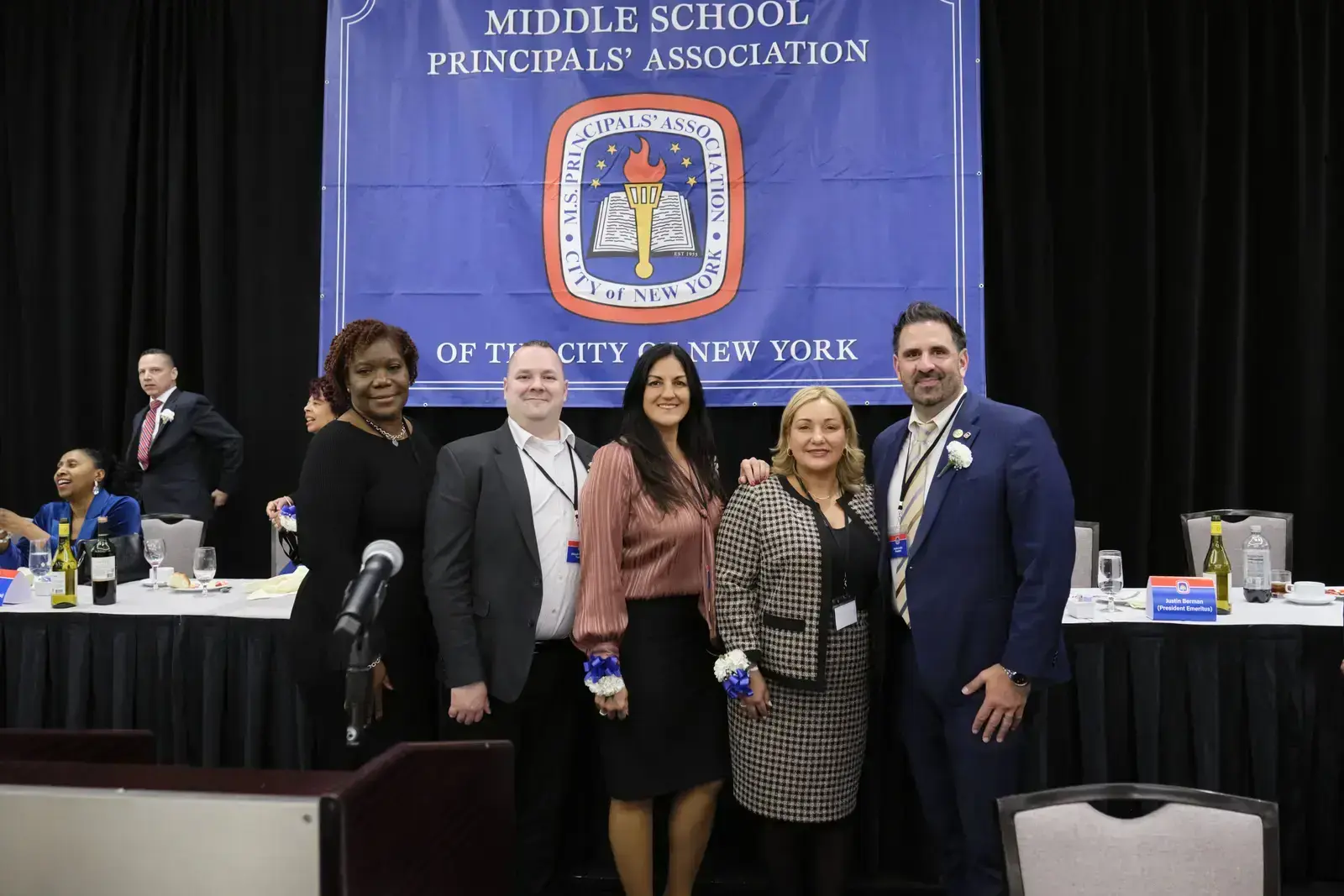 Five middle school principals pose at NYC Principals Association event