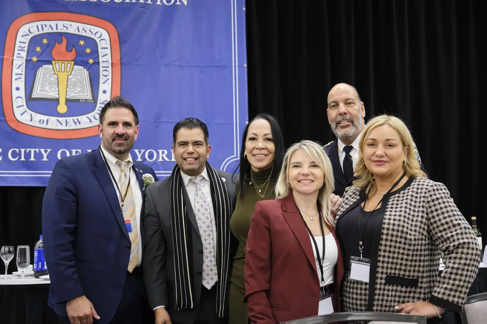 Six school administrators pose together at ASPRI-CIPALS Association event