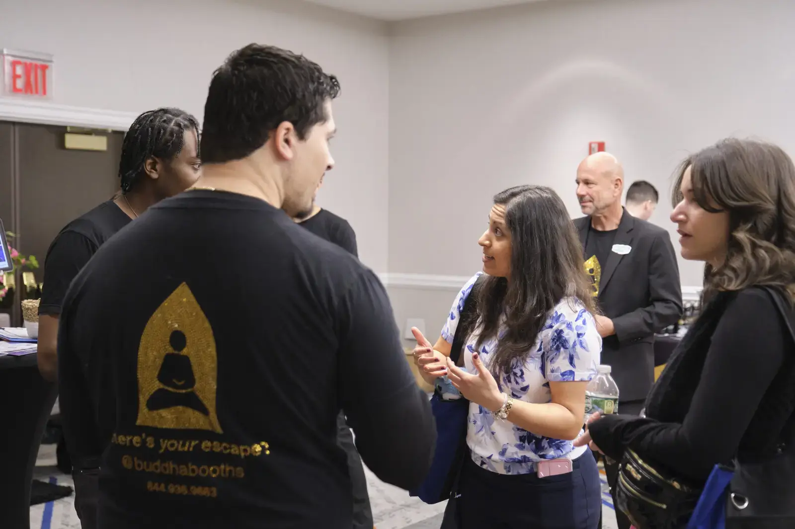 Attendees networking and conversing at school event