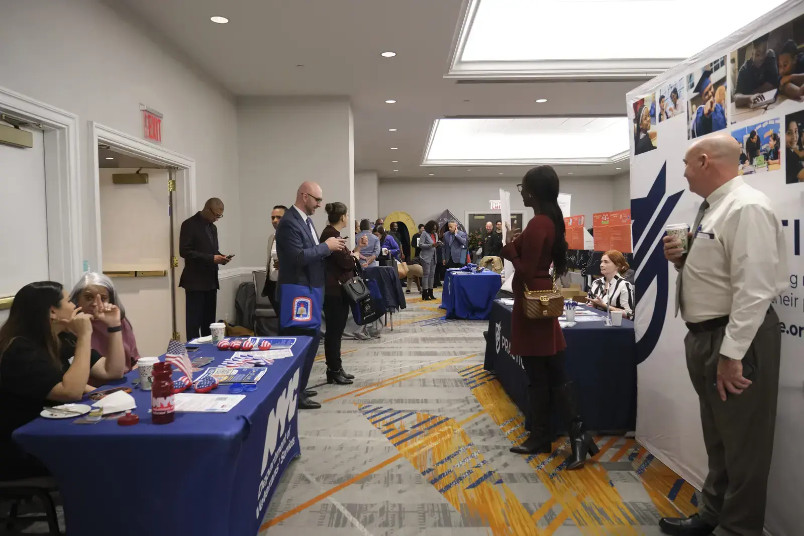 Attendees networking with recruiters at college and career fair