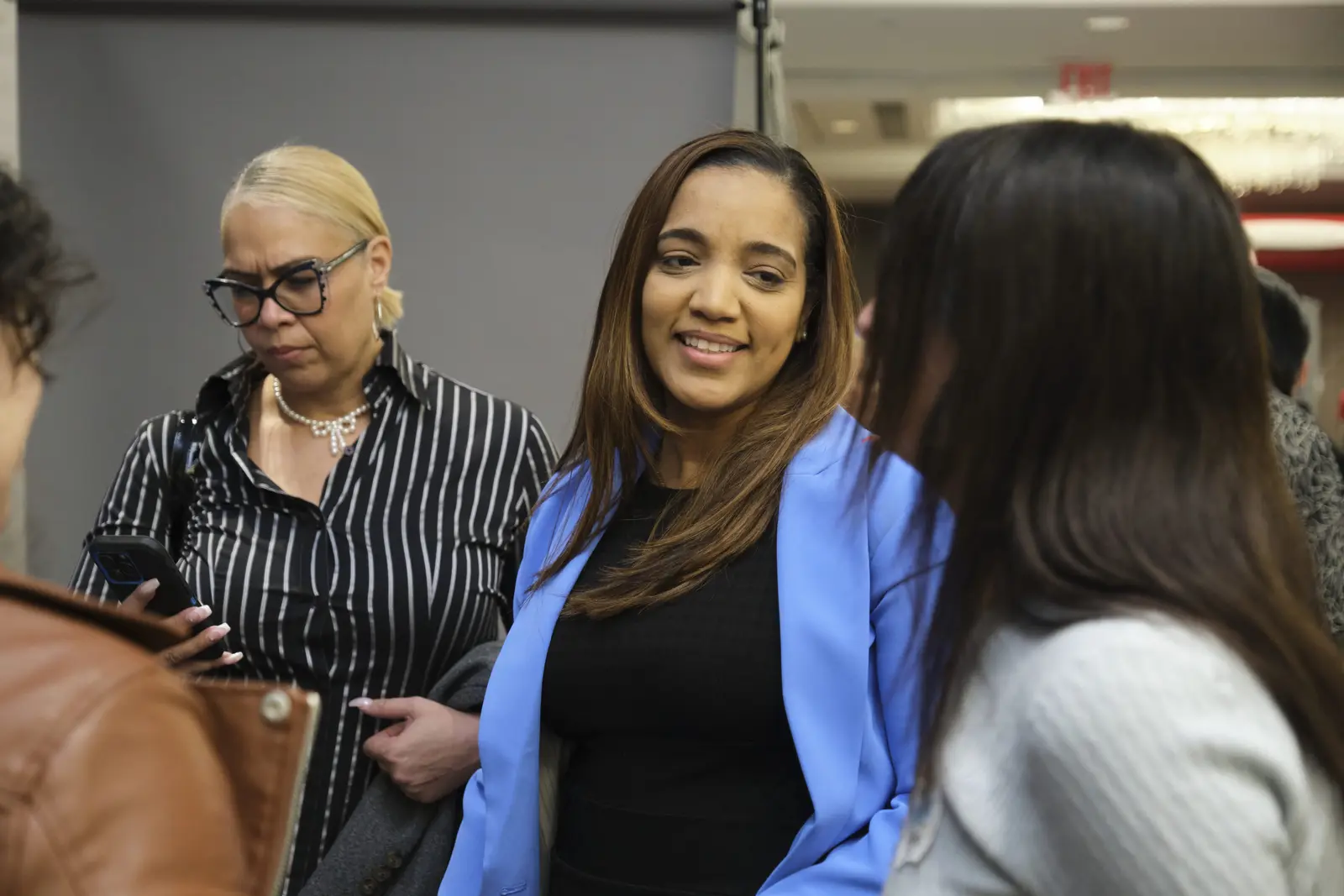 Parents and staff members engaging in conversation at school event