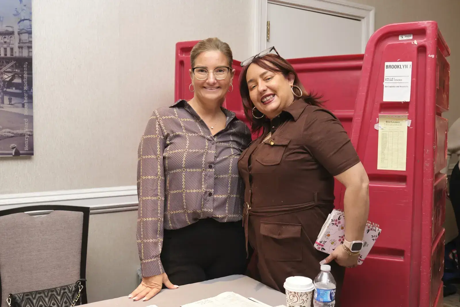 Two staff members posing together at school event