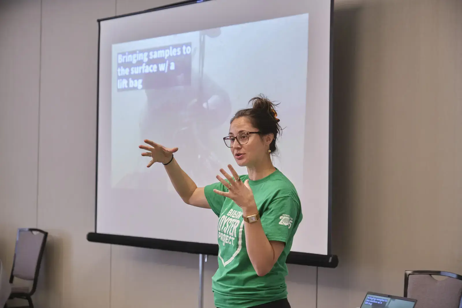 Presenter explaining marine science research during educational workshop