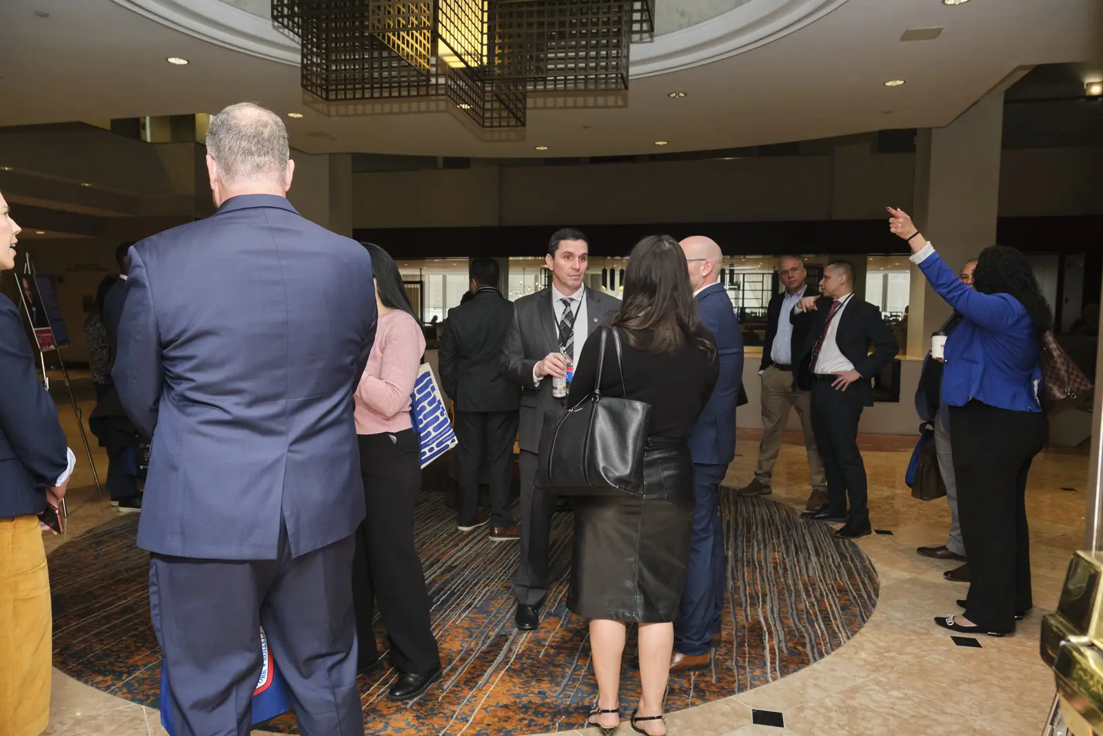 Professionals networking at indoor business event