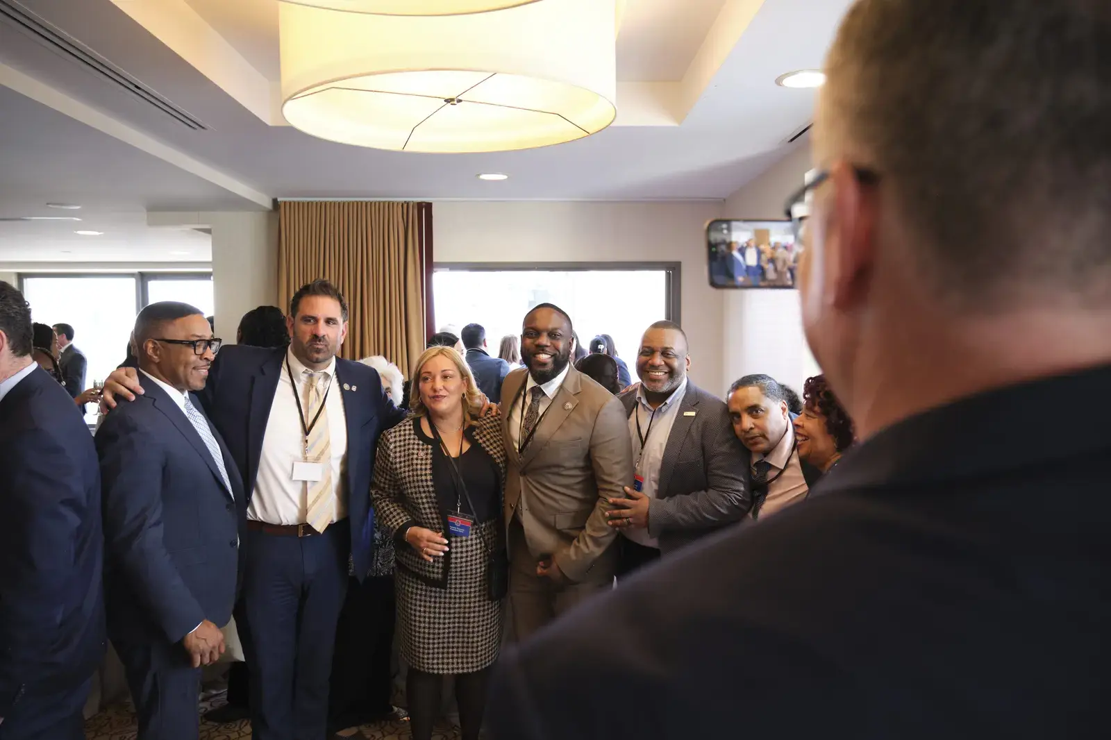 School administrators and staff posing together at professional event