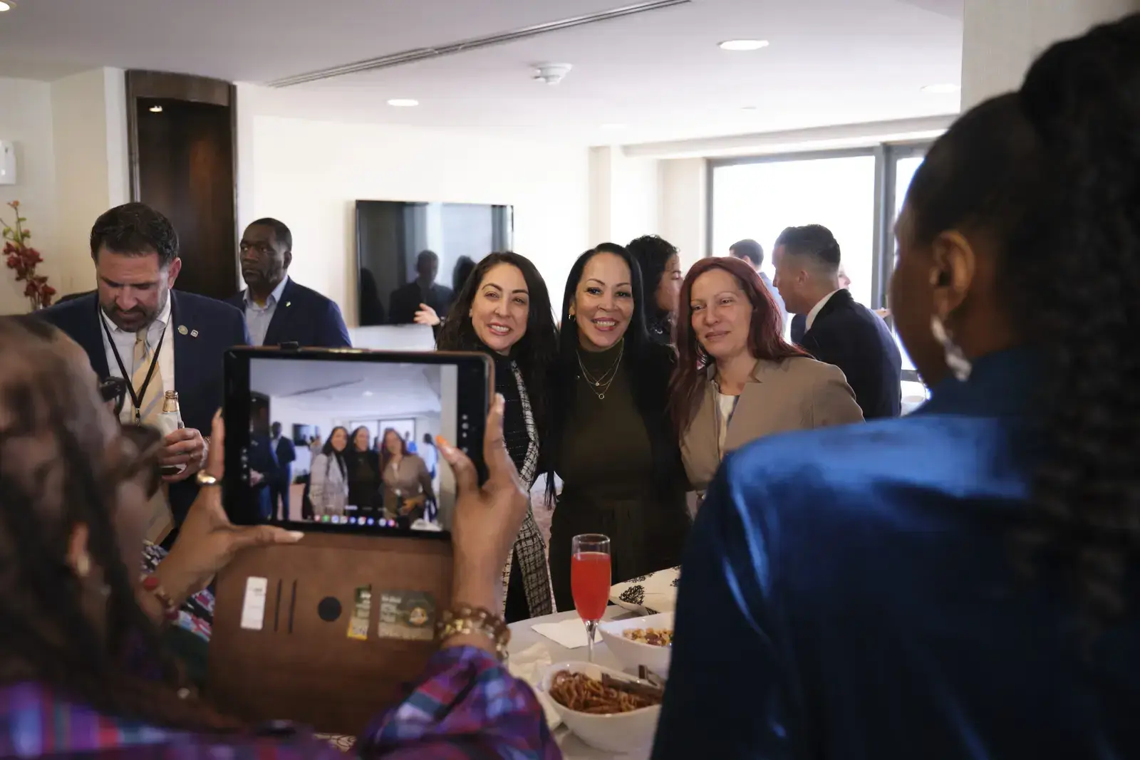 Attendees posing for group photo at networking event