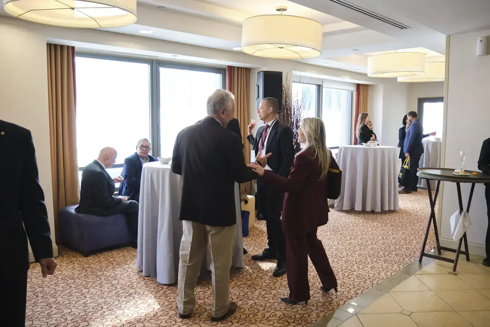 Professionals networking at business reception event
