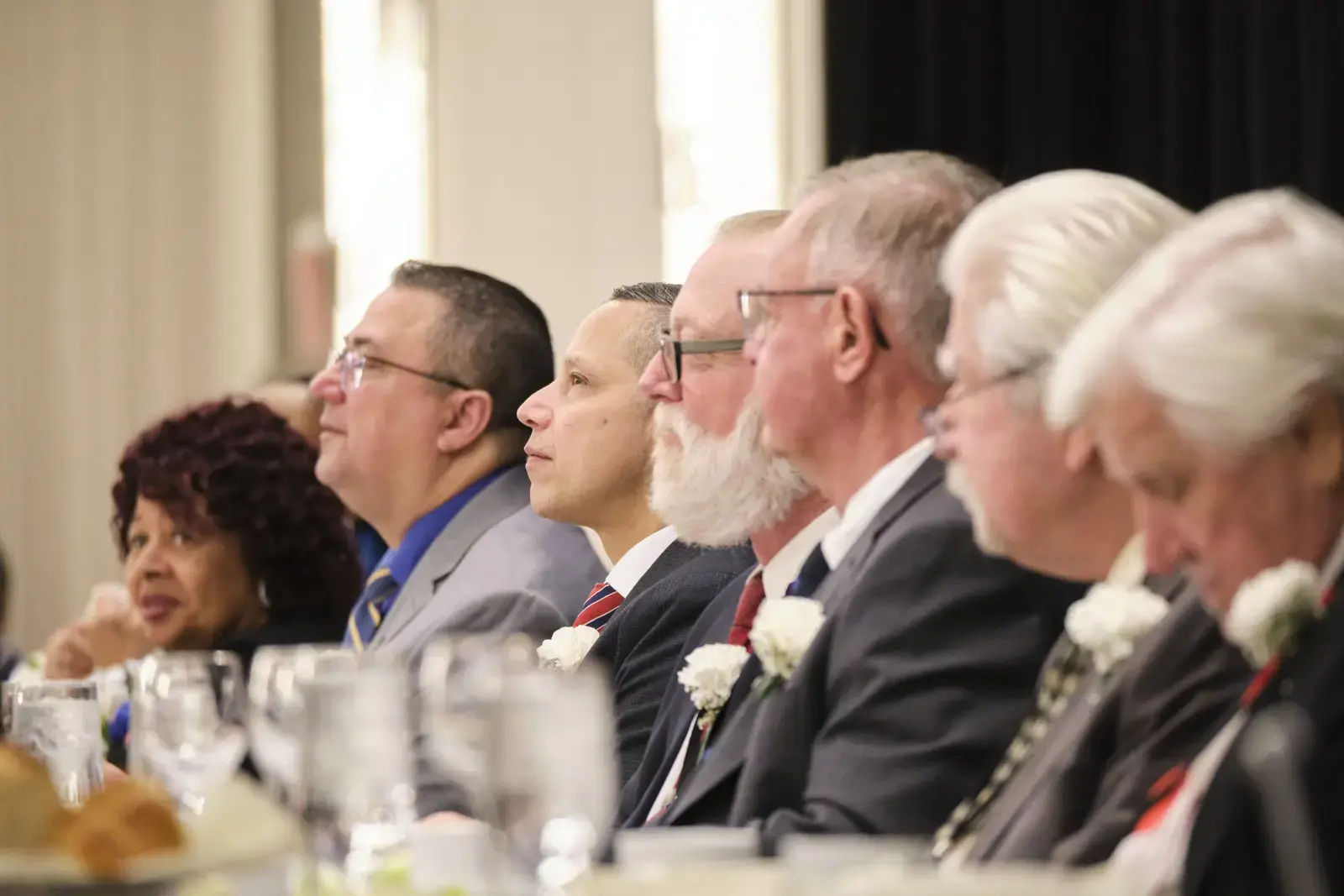 School board members seated at formal event table