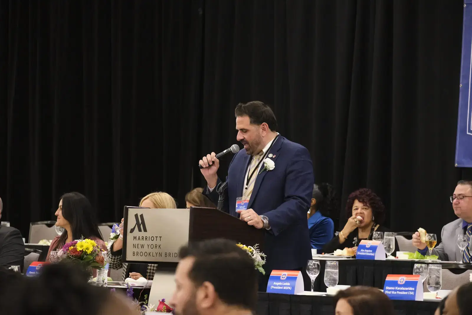 Speaker addressing attendees at Marriott New York Brooklyn Bridge event