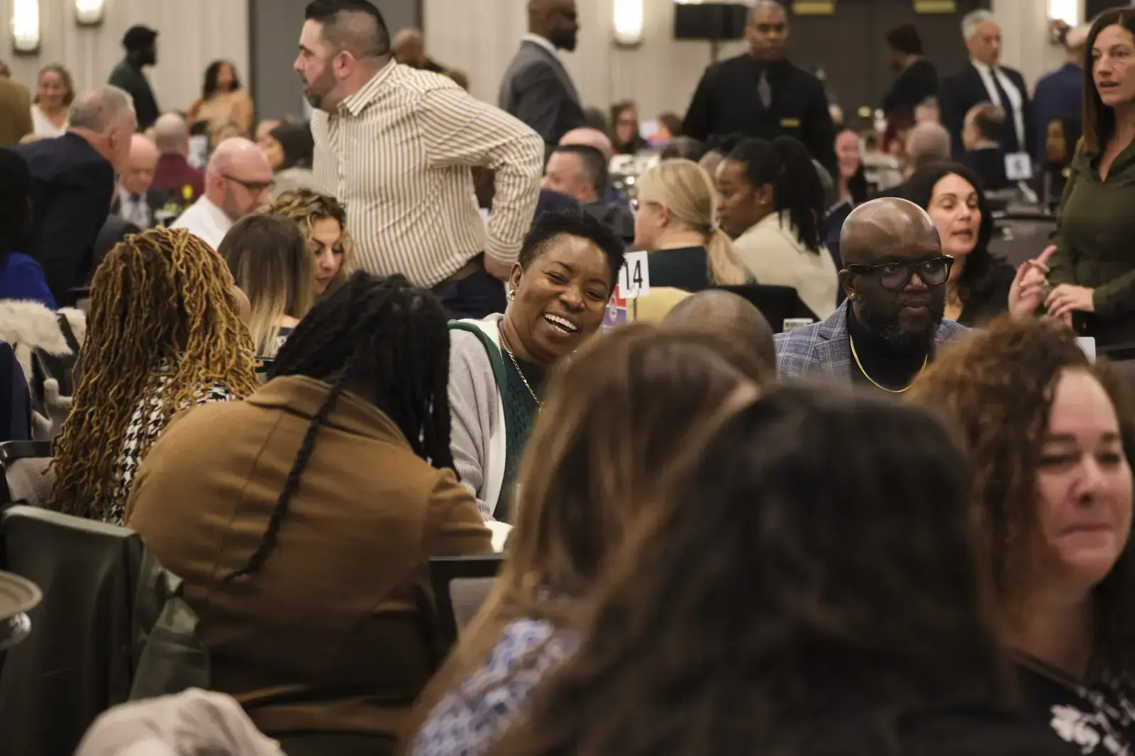 Attendees networking and socializing at school event
