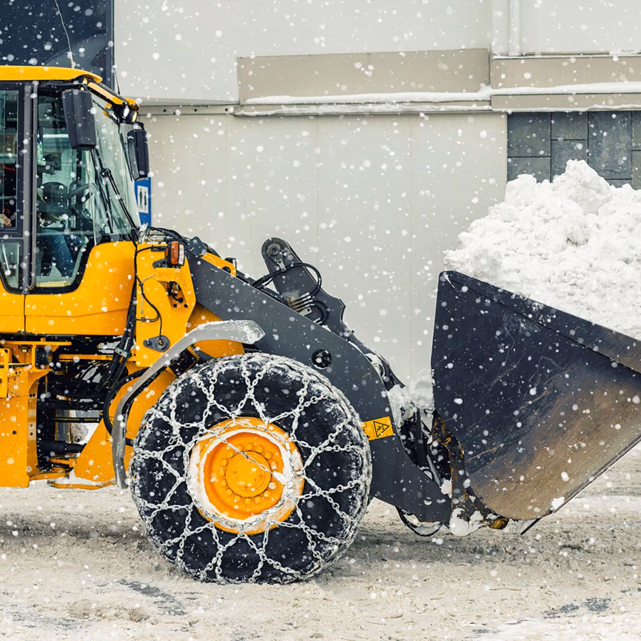Parking lot snow plowing and ice management near me in Metro Detroit