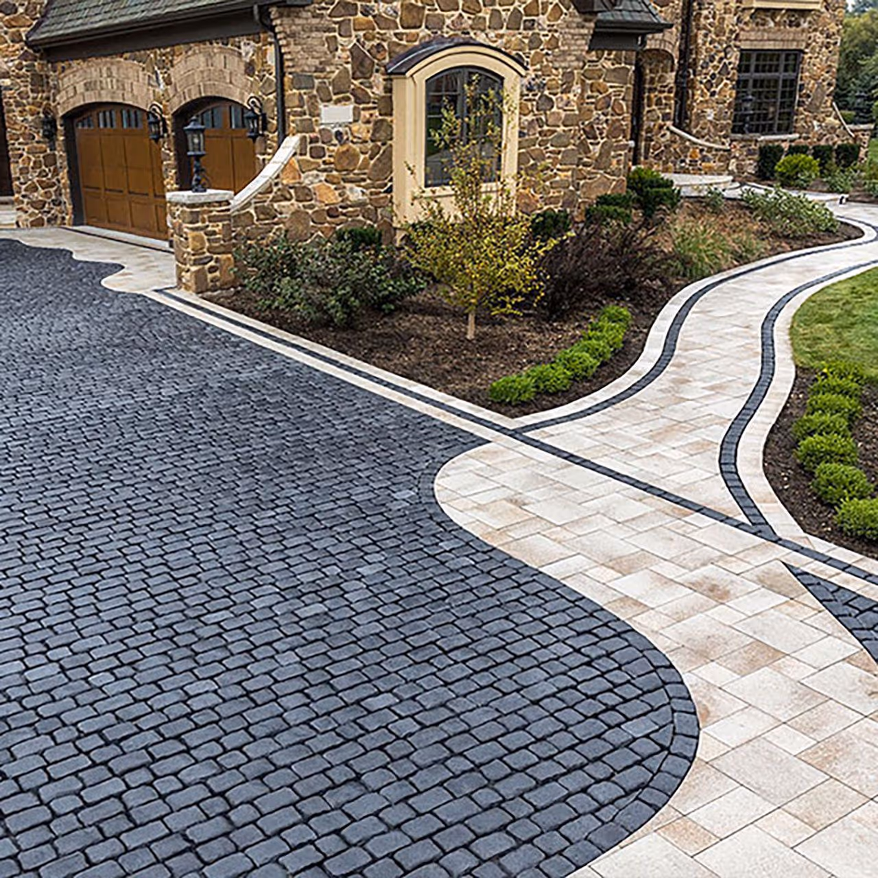 Custom paver driveway installation by Roi Property Services designed for durability, drainage control, and long term performance in Metro Detroit