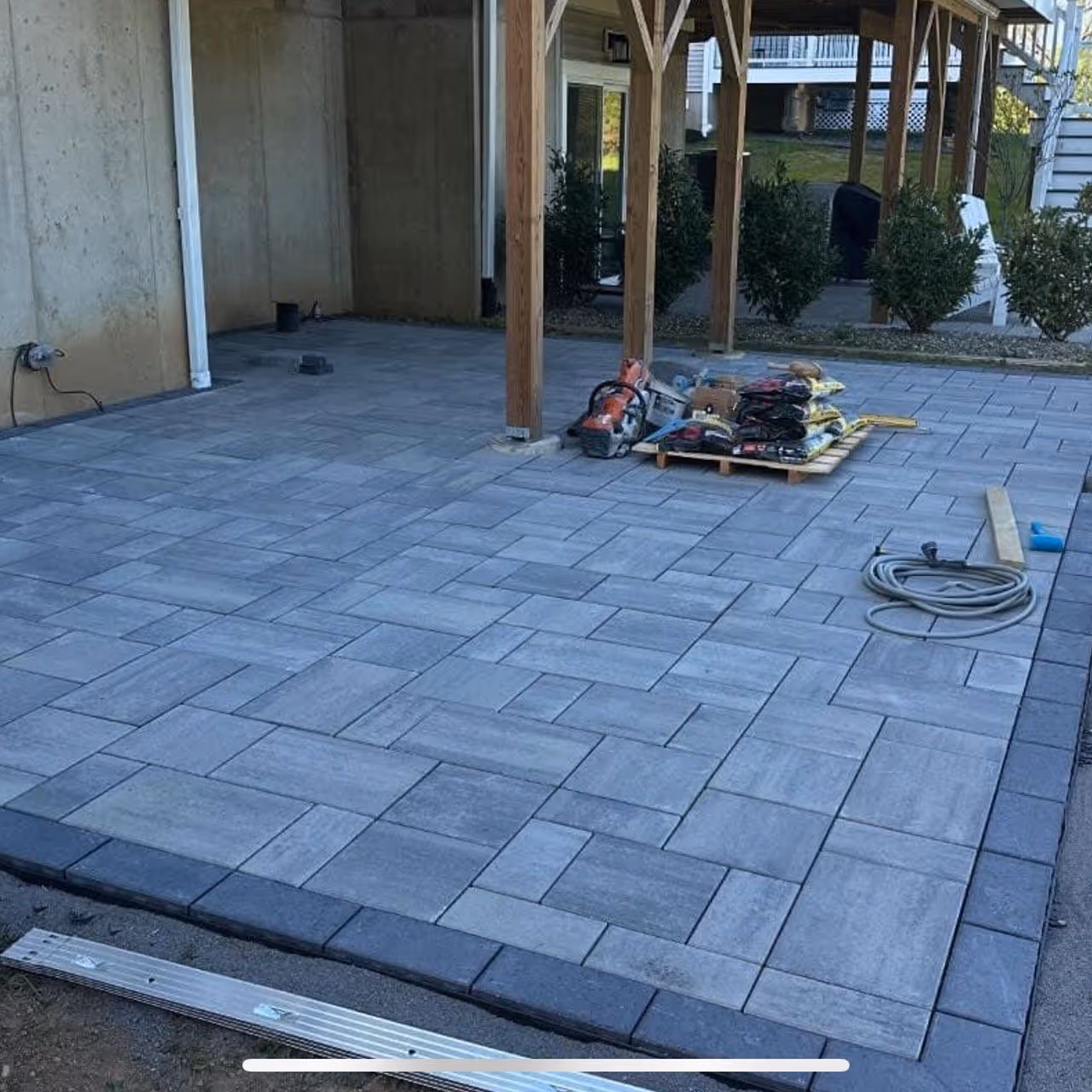 Custom patio paver installation by Roi Property Services built for proper drainage and long term performance in Metro Detroit