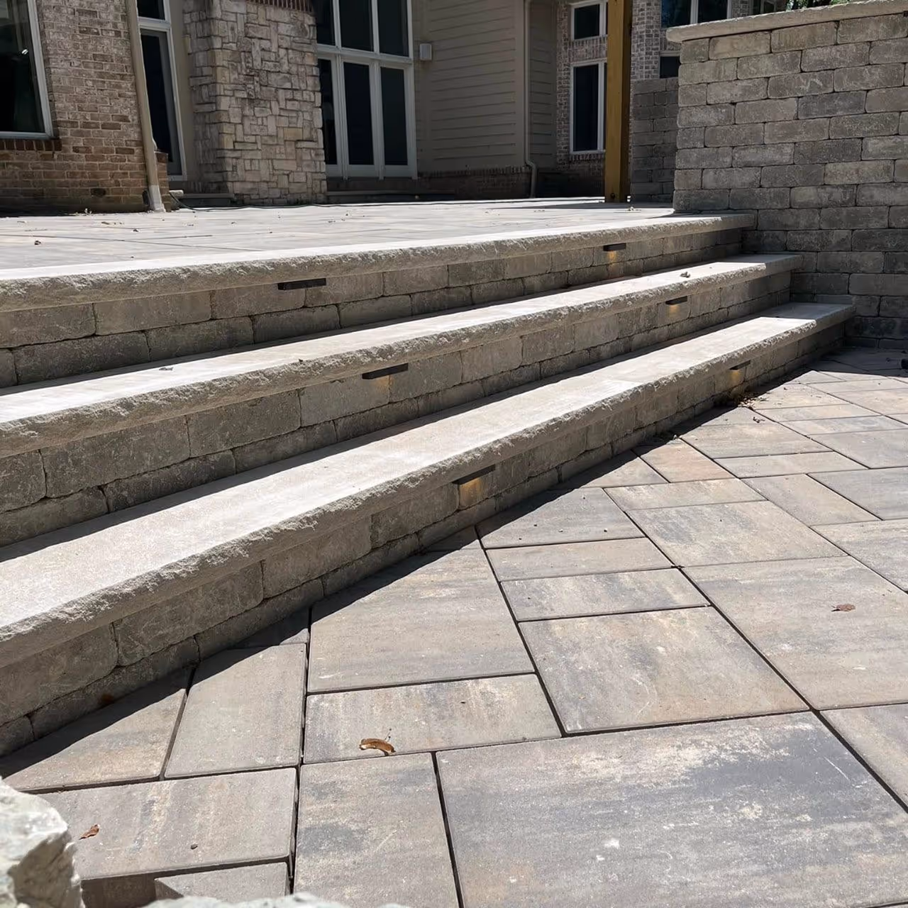 Experienced crew from Roi Property Services installing drainage and hardscape features for residential and commercial properties in Metro Detroit