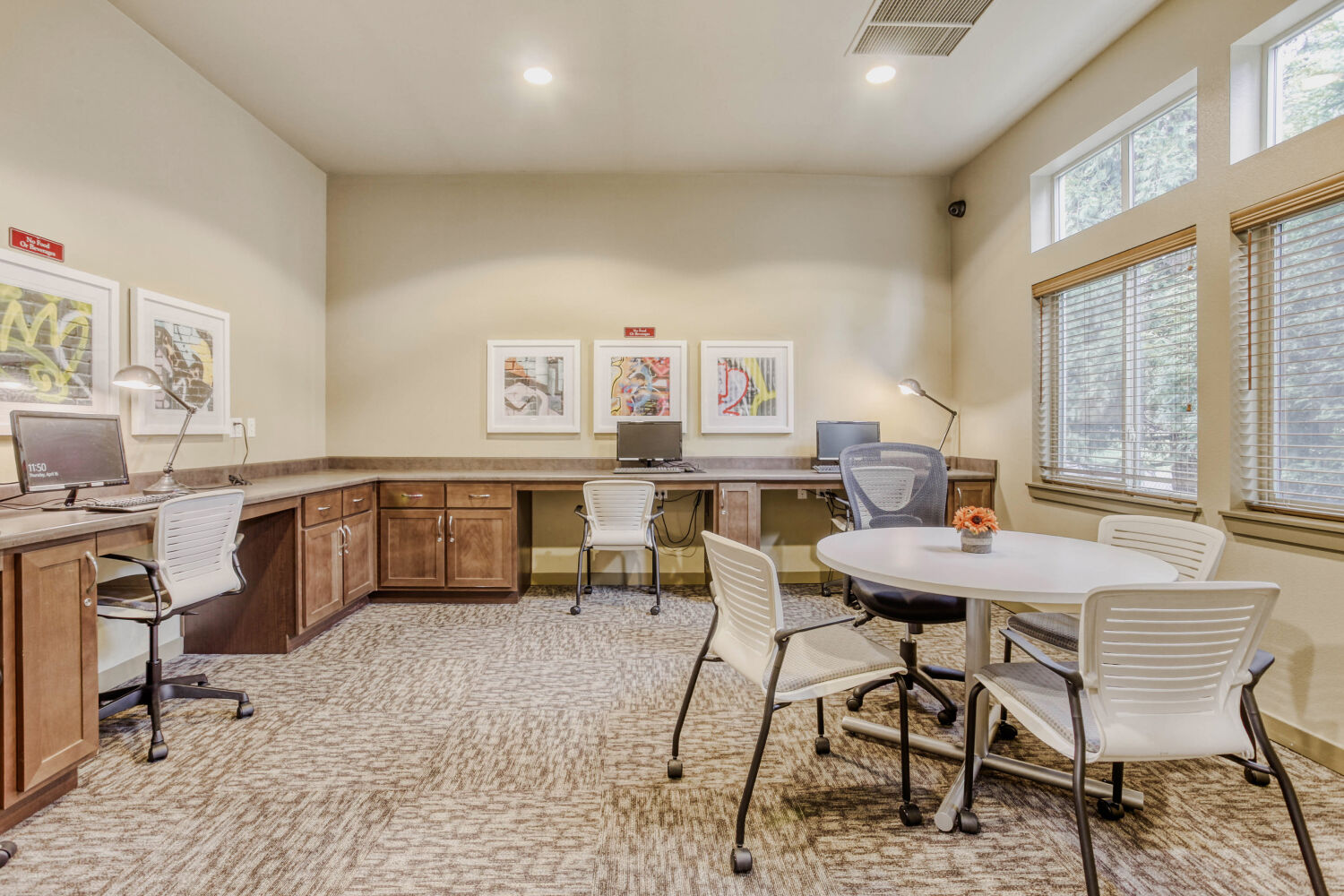 Copper Lane Amenities Business room with table, computer desks and chairs