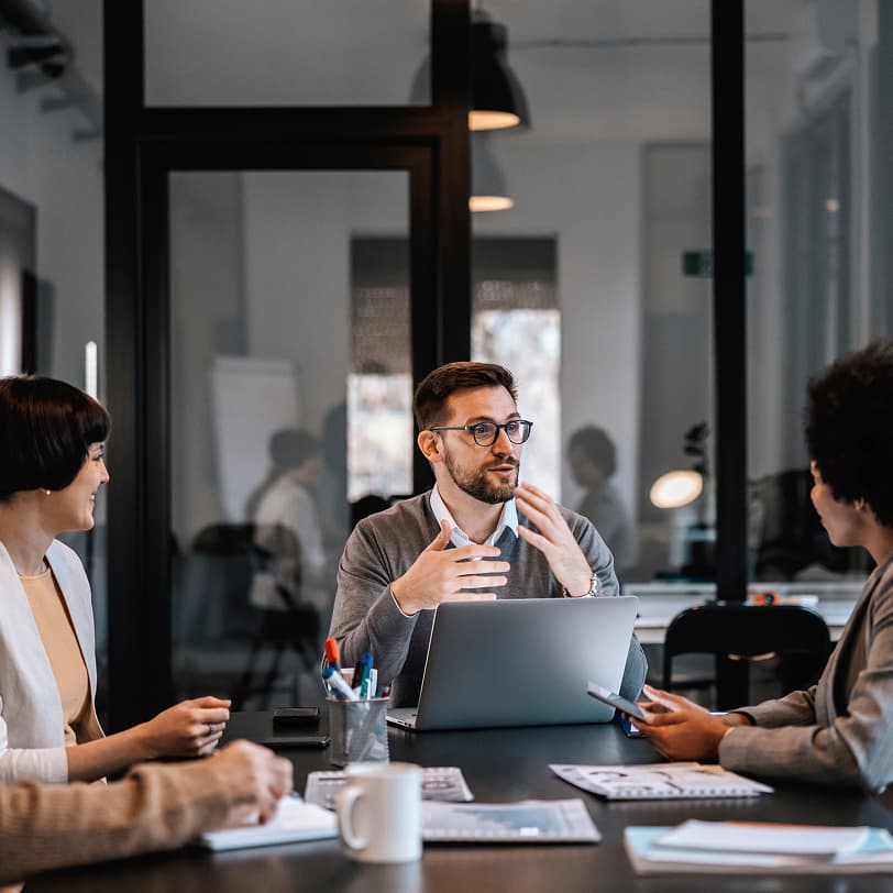 executives talking in office setting