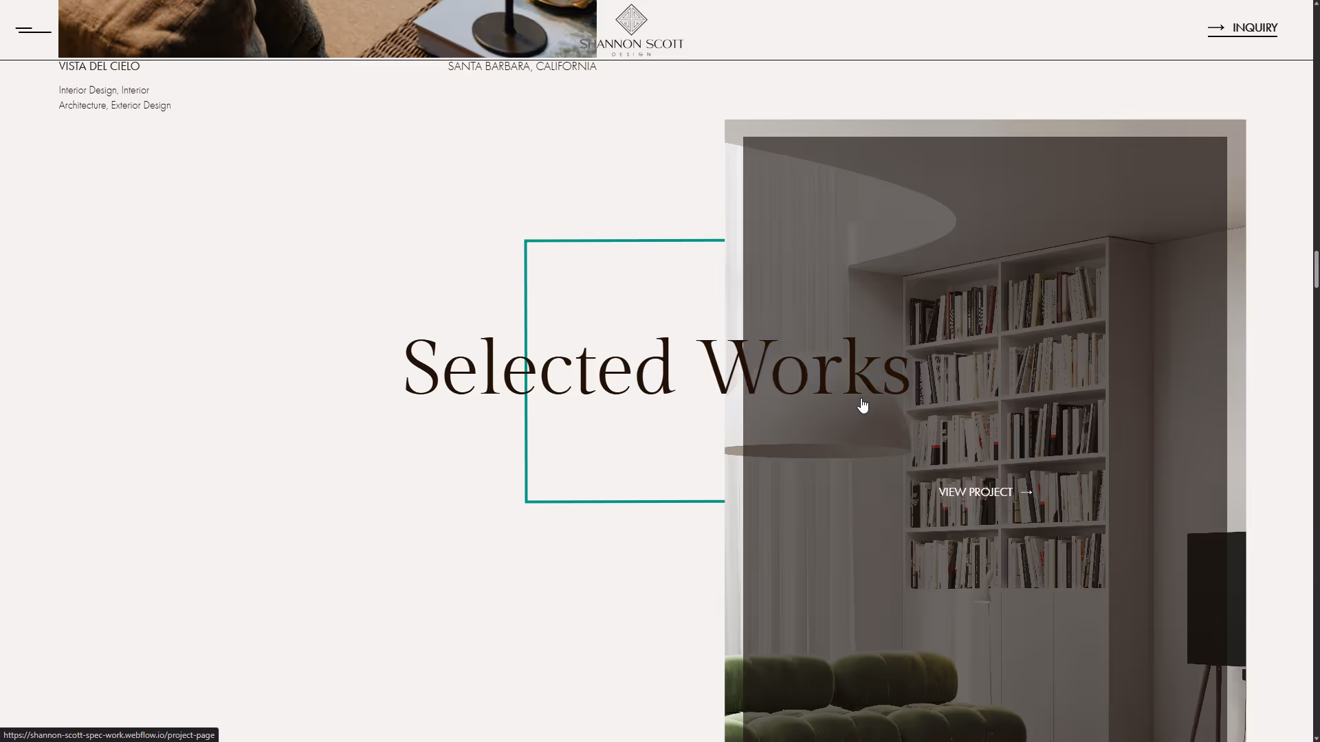 Modern interior with white built-in bookshelves filled with books, a green tufted sofa, and a minimalist floor lamp.