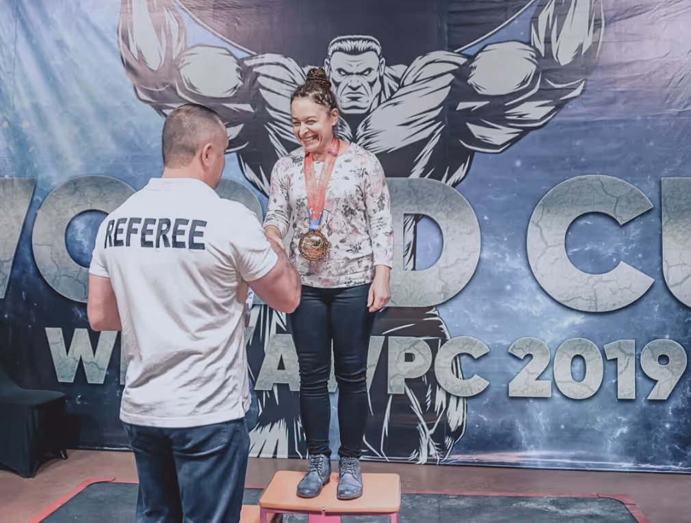 Irina receiving her medal at AWPC World Cup 2019