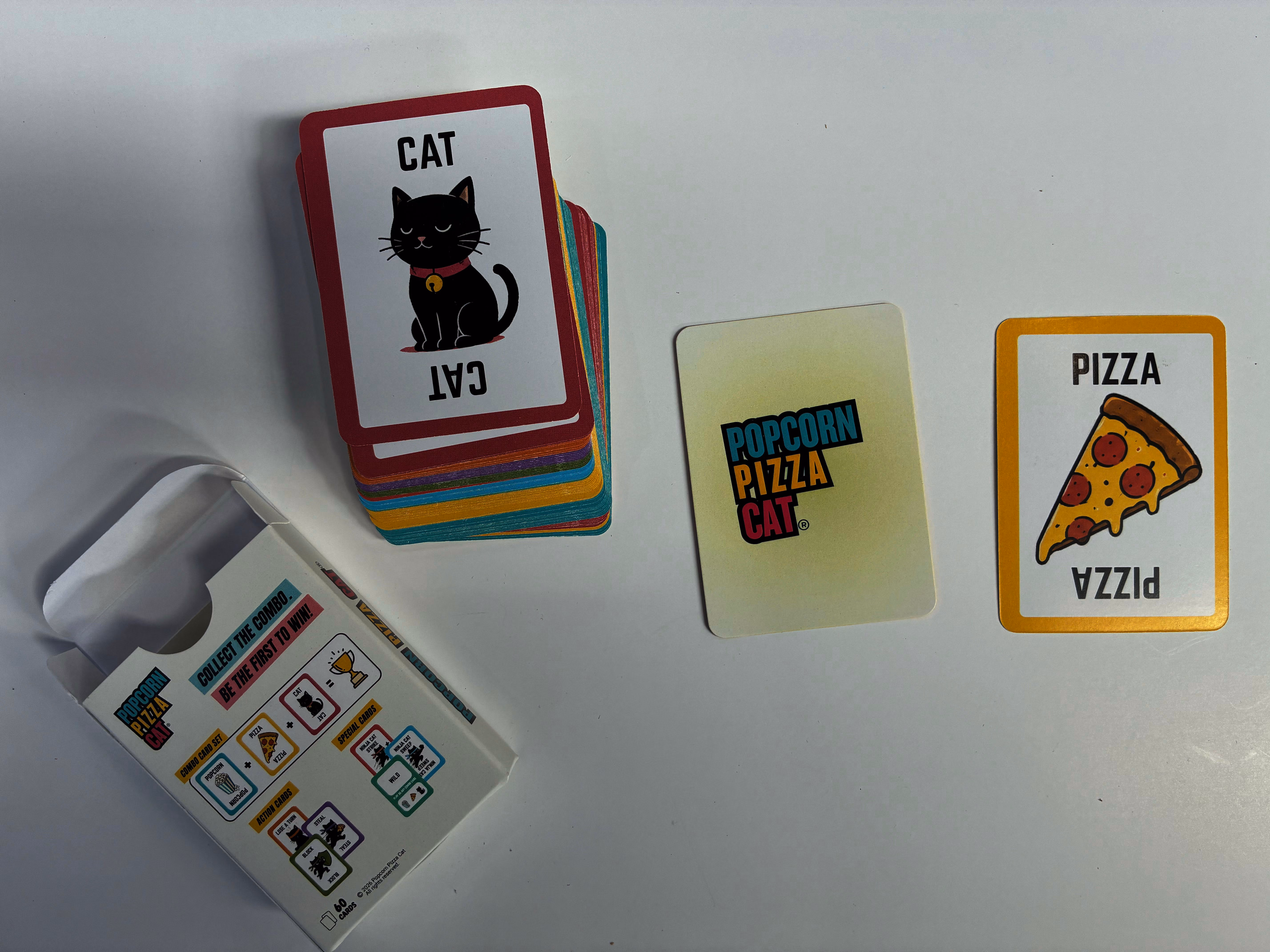 Popcorn Pizza Cat 60-card game with printed tuck box and colour-coded cards