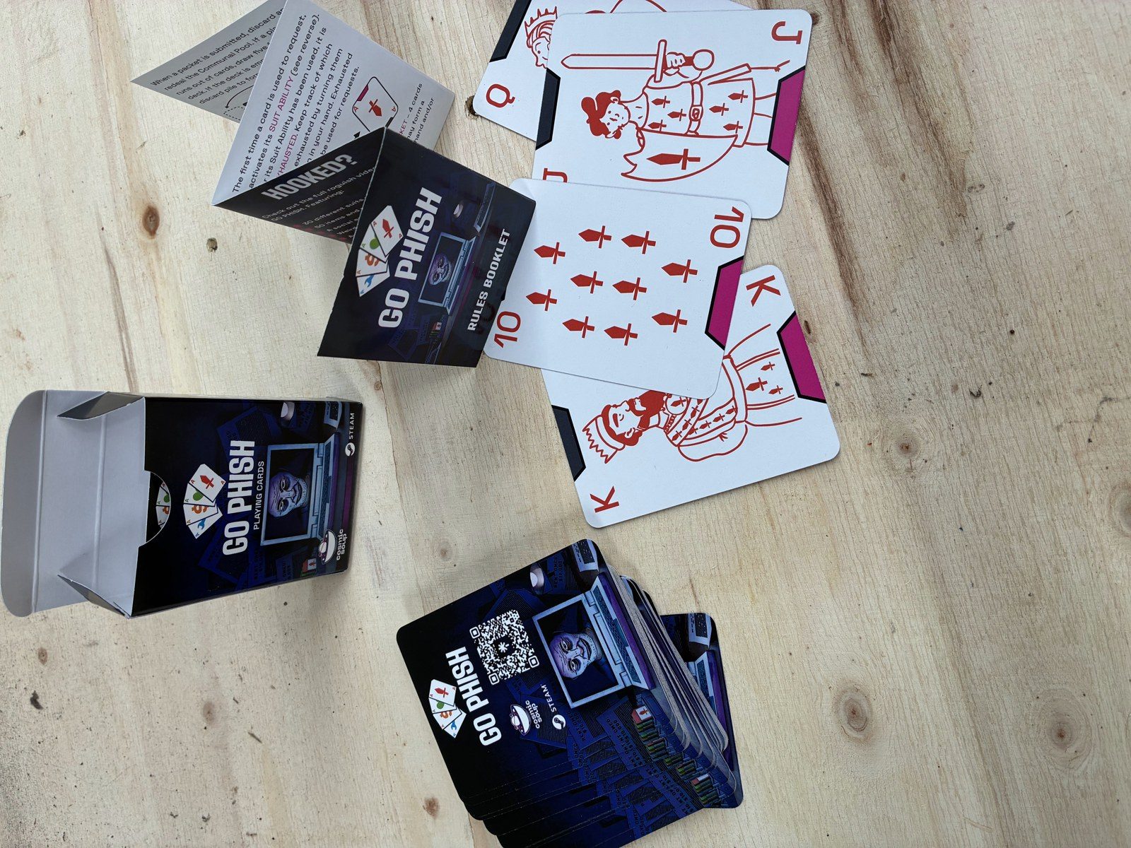 Go Phish playing card deck printed in New Zealand with custom suits, printed tuck box and folded rules booklet