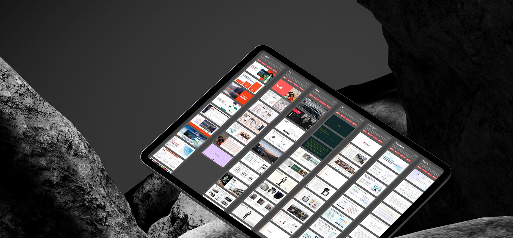 Tablet displaying multiple columns of pitch decks against a dark stone background.