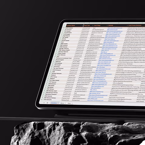 Laptop screen showing a detailed investor list spreadsheet with names, fund types, websites, and focus areas.