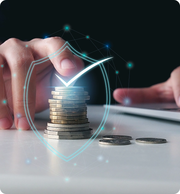Hand stacking coins on a table with a glowing shield and checkmark graphic overlay symbolizing financial security.