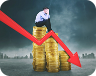 Man in business attire sitting on a stack of coins with a downward red arrow indicating financial loss or decline.