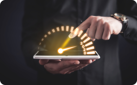 Person holding a smartphone with a glowing speedometer graphic above it showing the year 2020 and a hand pointing at the gauge.