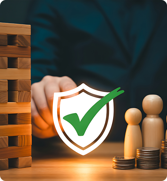 Wooden blocks stacked on left, wooden figurines with stacked coins on right, and a shield with a green checkmark symbolizing asset protection in the center.